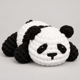 Free Pando kit — a crocheted black-and-white panda lying down